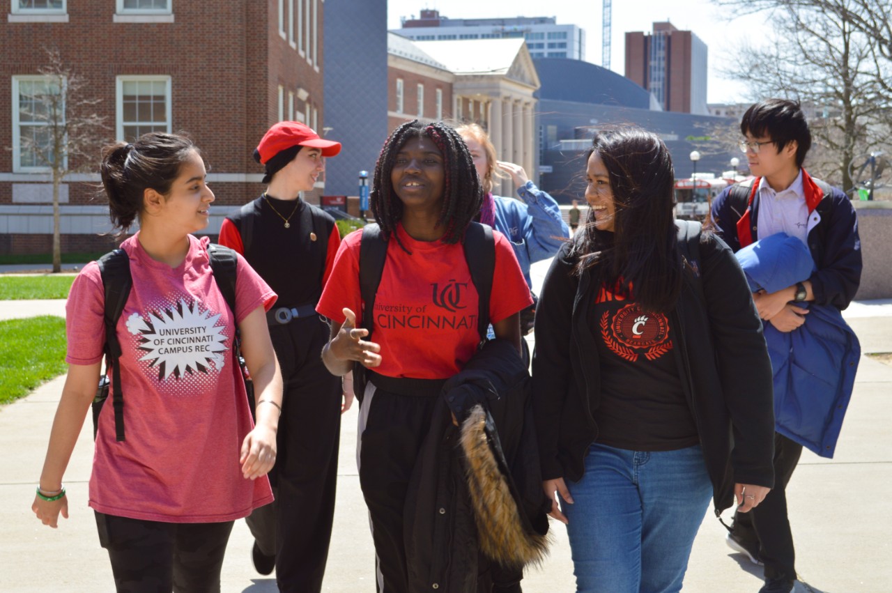 A group of Taiwanese students stand with the University of Cincinnati Bearcat mascot at an International Taste event.